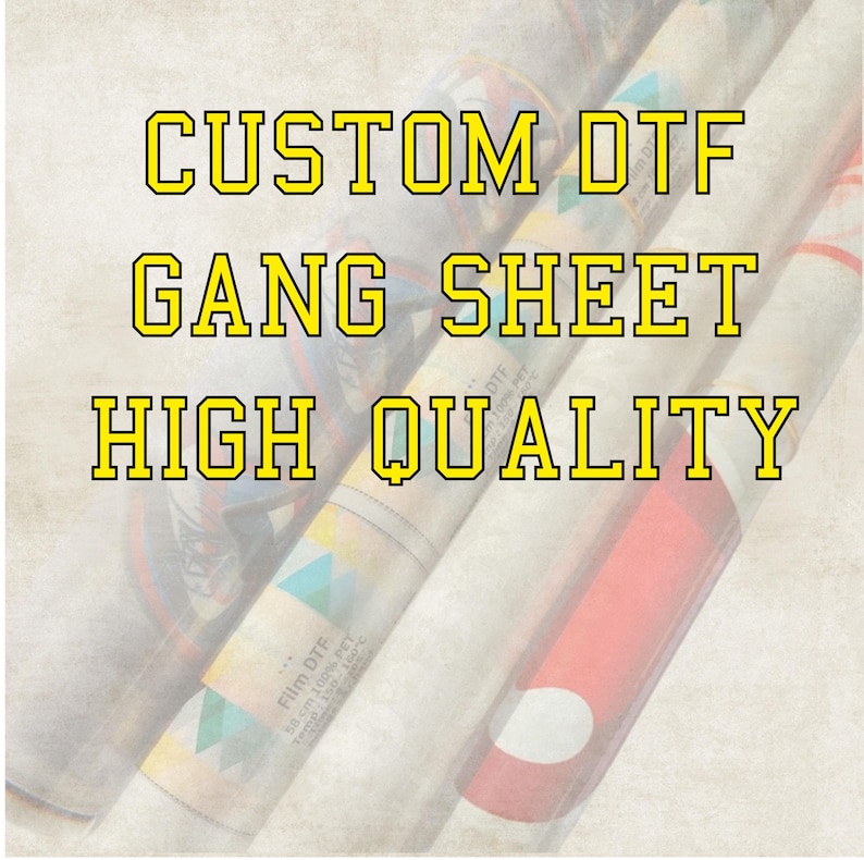 May include: Image of rolled sheets with the text "CUSTOM DTF GANG SHEET HIGH QUALITY" in yellow outlined letters. The rolls are white and beige with colorful designs and red accents.
