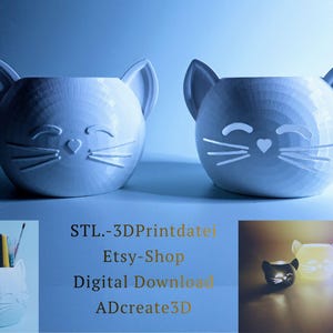 May include: Two white cat-shaped planters with smiling faces and whiskers. The planters have large ears and are designed to hold plants or other items. The image also shows a cat-shaped pen holder and three glowing cat-shaped objects.