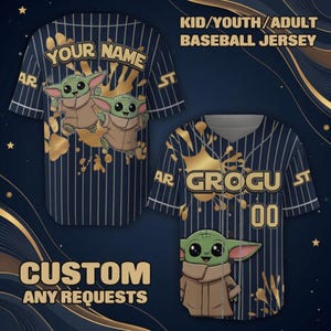 May include: Navy blue baseball jersey with white pinstripes and gold accents. Features a cartoon Grogu character and the text "YOUR NAME" and "GROGU". The jersey is customizable and available in kid, youth, and adult sizes.