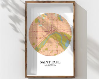 May include: Framed print showing a circular map of Saint Paul, Minnesota, in neutral tones. The map details roads, parks, and the Mississippi River. The text "SAINT PAUL MINNESOTA" is below the map.