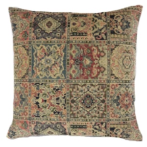 May include: Square throw pillow with a tapestry design. The pillow features a repeating pattern of squares with floral and geometric motifs in shades of red, blue, green, and beige. The pillow is a decorative home accent.