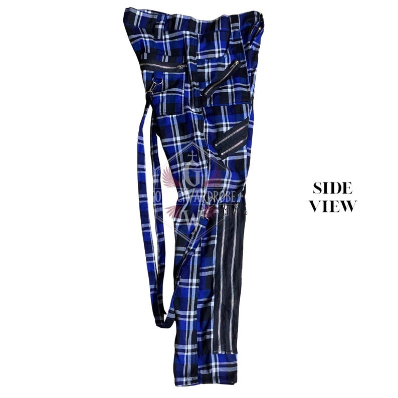 May include: Blue and black plaid pants with multiple zippers and a black vertical stripe down the side. The pants have a long belt and are displayed from a side view.