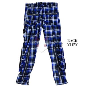 May include: Back view of blue, black, and white plaid pants with multiple zippers and pockets. The pants have a straight leg design and feature silver-colored hardware. The words "BACK VIEW" are printed in black.