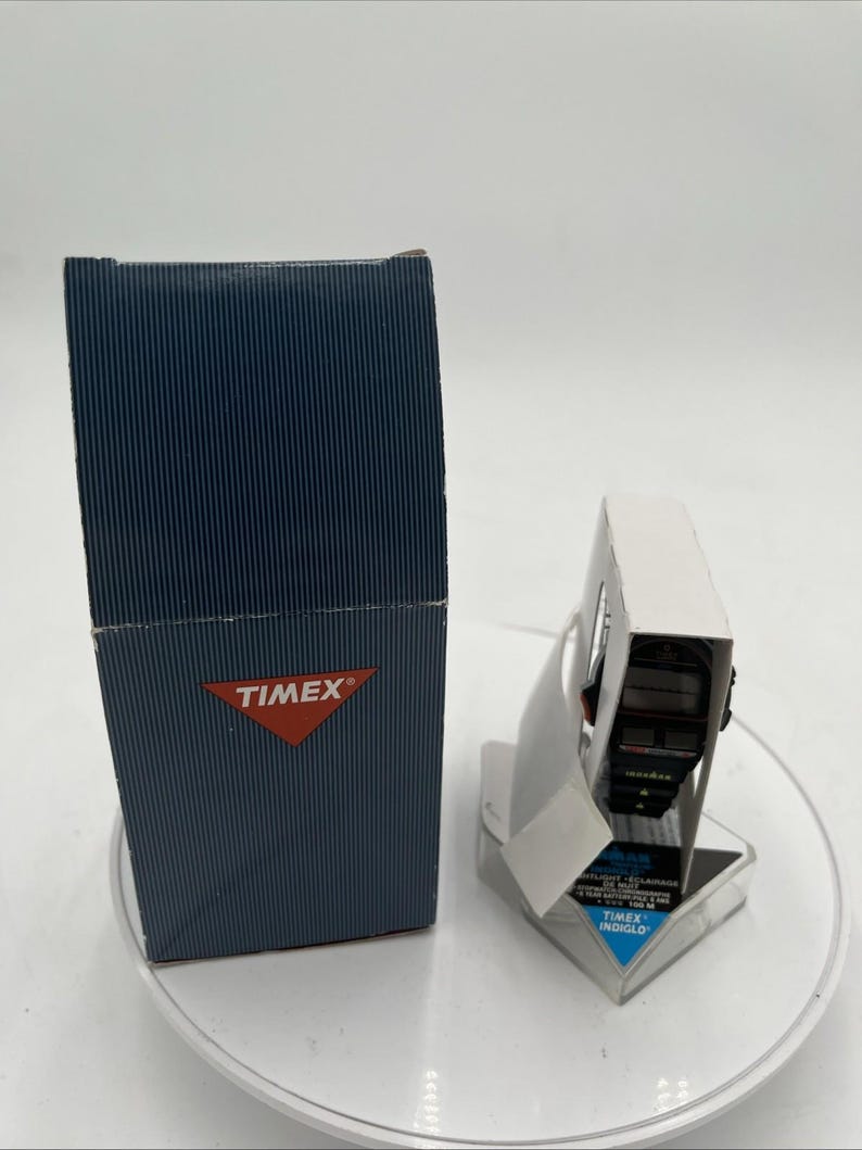 May include: A white ceramic mug with a black handle and the text "But First, Coffee" in a handwritten style. The mug is likely 11-15 ounces, perfect for a morning beverage. Ideal for coffee or tea lovers.