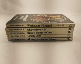May include: A stack of five vintage books from "The Supernatural" series. Titles include "Witches and Witchcraft," "Wisdom From Afar," and "Alchemy, the Ancient Science." The book covers are primarily white with black text.