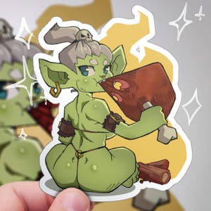 May include: A sticker featuring a green goblin-like character with gray hair and a skull headpiece, biting into a large piece of cooked meat. The character has blue eyes and is wearing brown wrist and ankle cuffs. The background is yellow with white star-like shapes.
