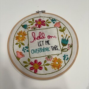 Embroidery Hoop Art Wall Hanging Funny Quote Design Hand Stitched Textile Piece Colorful Floral Pattern Overthinking Humor Text Handmade Fiber Art Quirky Office Desk Accessory Mental Health Gift Idea Anxiety Relief Item Display Shelf Decor