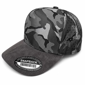 May include: A grey and black camouflage snapback cap with a dark grey suede-like brim. The cap features perforated side panels for ventilation and a circular sticker on the brim that reads THE PIONEER OF AUTHENTIC HEADWEAR SNAPBACK HIGH QUALITY FLAT PREMIUM HEADWEAR.