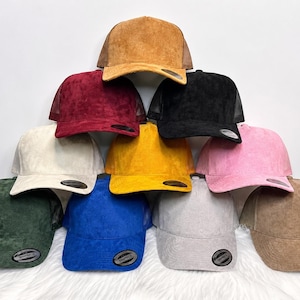 Suede trucker mesh cap. 5 panel front adjustable SnapBack.