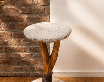 Cat stool made of real natural wood with a fluffy lying surface