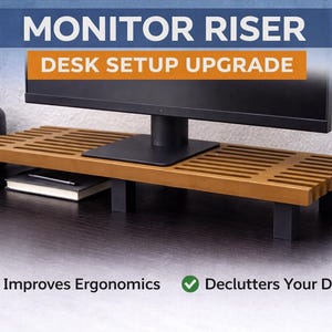May include: A wooden monitor riser with a slatted design, supported by black legs. The text on the image reads "Monitor Riser Desk Setup Upgrade". The riser is designed to improve ergonomics and declutter the desk.