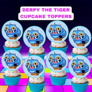 May include: Cupcakes with blue liners and white frosting, topped with circular toppers featuring a cartoon blue tiger. The toppers are labeled "DERPY THE TIGER CUPCAKE TOPPERS". The cupcakes are arranged on a colorful, patterned surface.