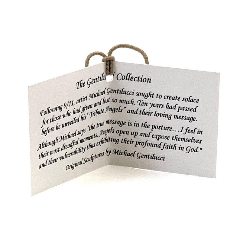 May include: A white folded paper tag with a tan string loop at the top. The text reads: The Gentilucci Collection. Following 9/11, artist Michael Gentilucci sought to create solace for those who had given and lost so much. Original Sculptures by Michael Gentilucci.