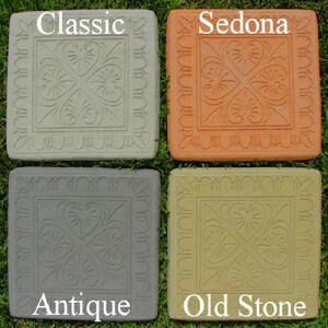 May include: Four square concrete stepping stones featuring a central embossed heart and leaf pattern with a decorative border. The stones are labeled Classic in light gray, Sedona in terracotta, Antique in dark gray, and Old Stone in tan.