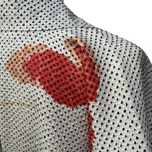 May include: A white kimono with a black polka dot pattern and a red and orange floral design on the back.