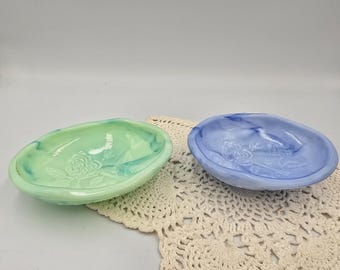 Set of two vintage avon milk glass rose emboissed soap dishes. Marbled teal and blue and white swirl.