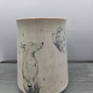 hand-thrown studio stoneware vase by Moon Mountain Pottery featuring a fox and a butterfly.