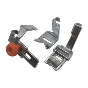 May include: Three silver metal sewing machine presser feet. One foot features an orange plastic adjustment knob, one has a simple angled metal bracket, and the third includes a textured metal roller mechanism for fabric feeding and guidance.