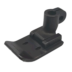 May include: A black metal sewing machine presser foot featuring a flat, rectangular base with two elongated slots and a hinged vertical shank with a circular opening at the top. The metal surface has a smooth finish with visible text markings.