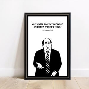 May include: Black framed print featuring a black and white illustration of a man in a suit with the quote "WHY WASTE TIME SAY LOT WORD WHEN FEW WORD DO TRICK?" and the name "-KEVIN MALONE".