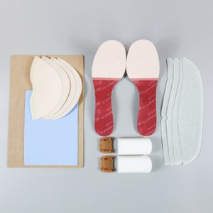 May include: Two red and white patterned shoe inserts, two pairs of white shoe inserts, and two pairs of heel pads.