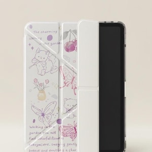 May include: A white tablet case adorned with a garden-themed design. The case showcases illustrations of butterflies, cats, cherries, and flowers in shades of purple and pink. Text on the case reads "The charming scenery in the garden" and "Walking in the garden you will find colorful flowers everywhere."