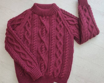 Toddler. Child's Hand Knitted Unisex Aran Jumper in Wine. Fit 26-28in 66-71cm chest. Other sizes and colours available.