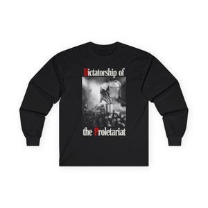 May include: Black long-sleeve shirt with the text "Dictatorship of the Proletariat" in red and white. The shirt features a black and white graphic of a statue and a crowd of people.