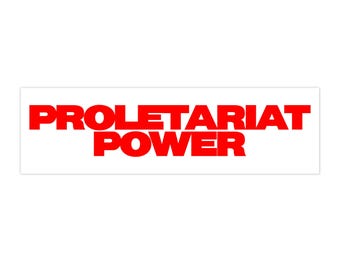 May include: A rectangular sticker with the words "PROLETARIAT POWER" in bold, red capital letters. The text is centered on a white background, creating a high-contrast design.