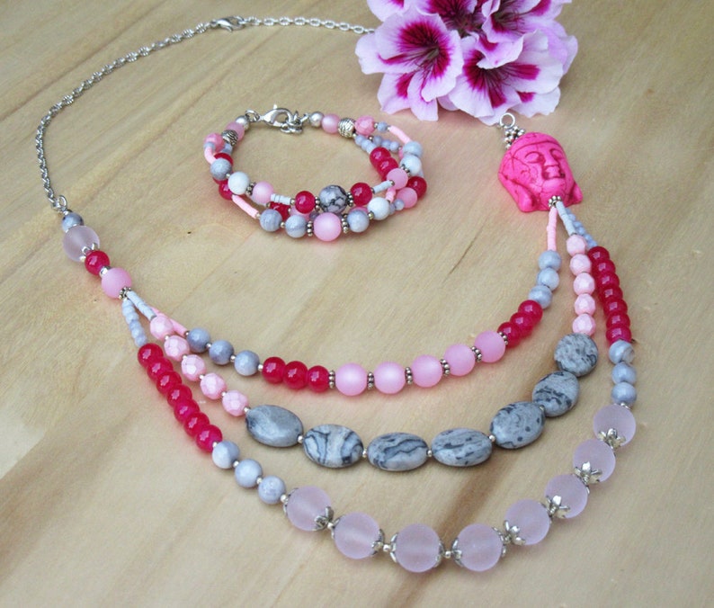 Buddha necklace in pink tones with three strands