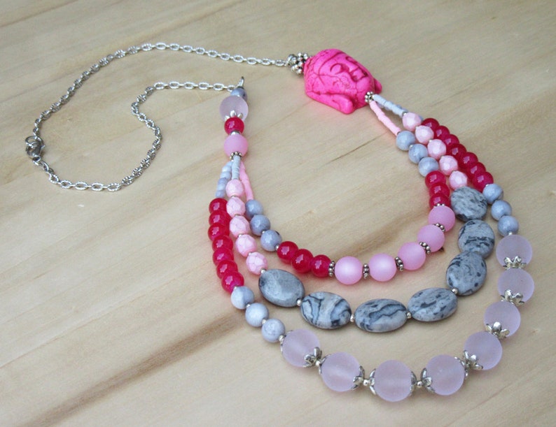 Buddha necklace in pink tones with three strands