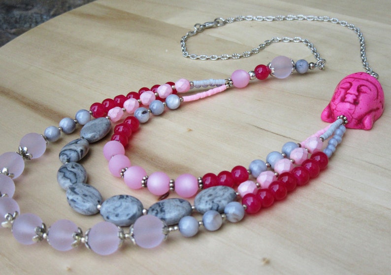 Buddha necklace in pink tones with three strands