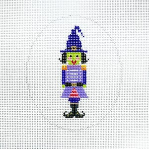 May include: A purple and green witch nutcracker ornament with a pointed hat and a striped dress.