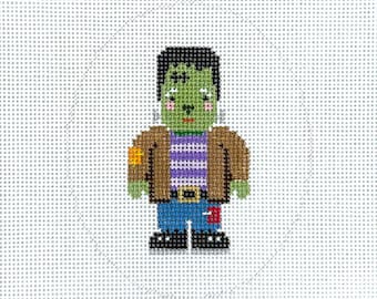 May include: A cross-stitch design of a cartoon Frankenstein's monster. The monster has green skin, black hair, and is wearing a brown jacket, a purple and white striped shirt, blue jeans, and black shoes. A small yellow patch is on the left shoulder.