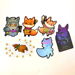May include: A selection of fox-themed stickers in various poses. The stickers depict foxes in different scenarios, such as a fox with a sword and shield, and a fox reading a book. The stickers are set against a white backdrop.