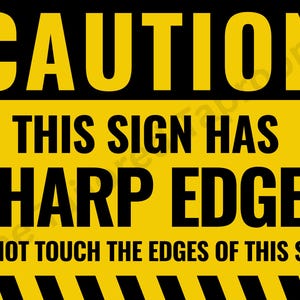 May include: A yellow and black warning sign with clear text. The top section reads "CAUTION" in yellow on a black background. The middle section states "THIS SIGN HAS SHARP EDGES" in black on yellow. The bottom says "DO NOT TOUCH THE EDGES OF THIS SIGN".