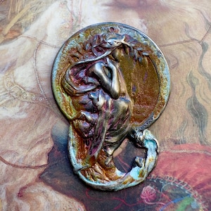 May include: A set of three ceramic mugs with a speckled, matte finish. The mugs are in shades of cream, light gray, and dark gray. Each mug has a simple, minimalist design and a rounded handle.