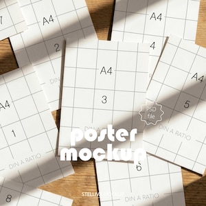 May include: A collection of white A4-sized paper mockups with a grid pattern, numbered 1 through 8, scattered on a wooden surface. The words "poster mockup" are prominently displayed. The image also includes the text "PSD file" and "DIN A RATIO".