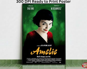 May include: A framed movie poster for the film "Amélie" featuring Audrey Tautou. The poster has a green background with the film's title in yellow and the tagline "She'll change your life." The poster is displayed on a wall.