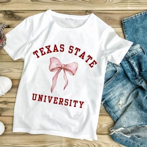 Texas State University Bow Graphic Tee, College Apparel, Graduation Gift, School Spirit Shirt, Unisex Heavy Cotton Tee, TXST, BOBCATS, SMTX