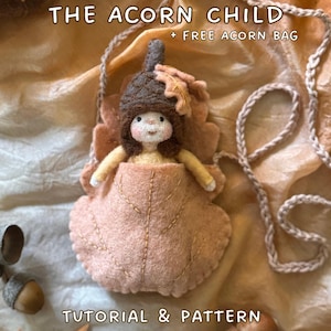 May include: A handmade felt doll in a leaf-shaped pouch, with the text "THE ACORN CHILD + FREE ACORN BAG". The doll has a brown acorn cap and a light brown leaf accent. The text "TUTORIAL & PATTERN" and the Instagram handle are also visible.