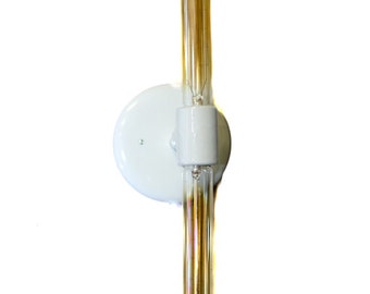 May include: White wall sconce with a single light bulb. The light bulb is a long, thin, clear glass bulb with a filament visible inside.