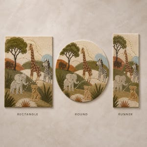 Round wool area rug hand-tufted with a safari scene of giraffes, zebras, an elephant, and acacia trees on a green and tan landscape.