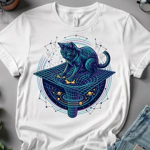 May include: White t-shirt with a graphic of a black cat on a black hole, with a geometric design. The cat is outlined in blue and green, with a cosmic background. The shirt has rolled-up sleeves.
