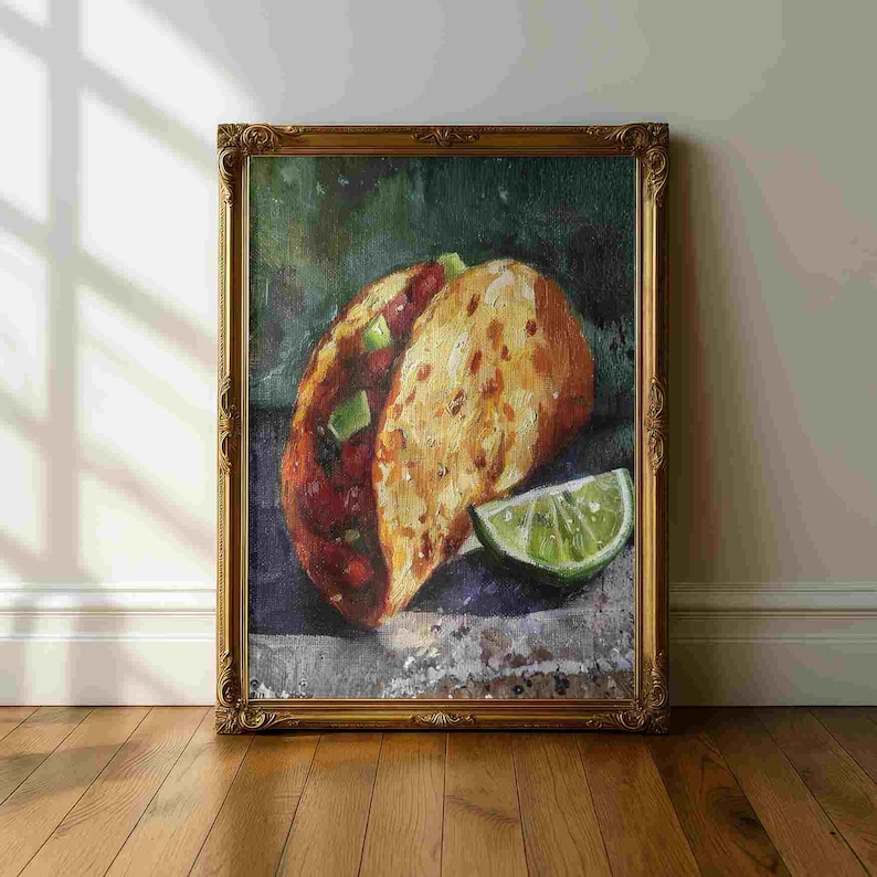 May include: An oil painting of a taco with a lime wedge, set in a gold ornate frame. The taco is filled with red ingredients and topped with green diced avocado. The taco shell is golden brown.