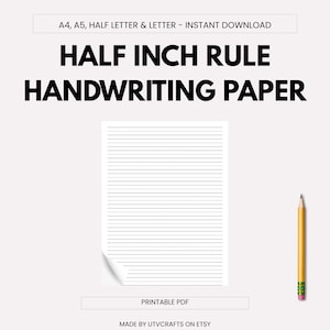 May include: A printable PDF handwriting paper with half-inch rule lines. The paper is white with gray lines and a curled corner. A yellow pencil with a pink eraser is on the right. Text on the image reads "HALF INCH RULE HANDWRITING PAPER."