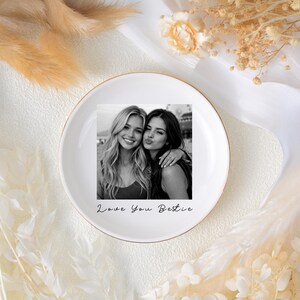 May include: White ceramic plate with a gold rim, featuring a black and white photo of two smiling women. The plate has the text "Love You Bestie" in a handwritten font.