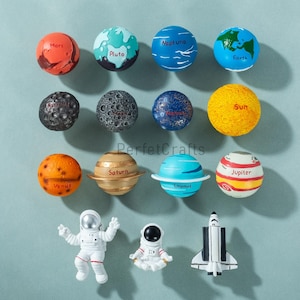 May include: A collection of colorful planet and space-themed toys. The planets include Mars, Pluto, Neptune, Earth, Venus, Saturn, Uranus, and Jupiter. Also included are two astronaut figures and a space shuttle.