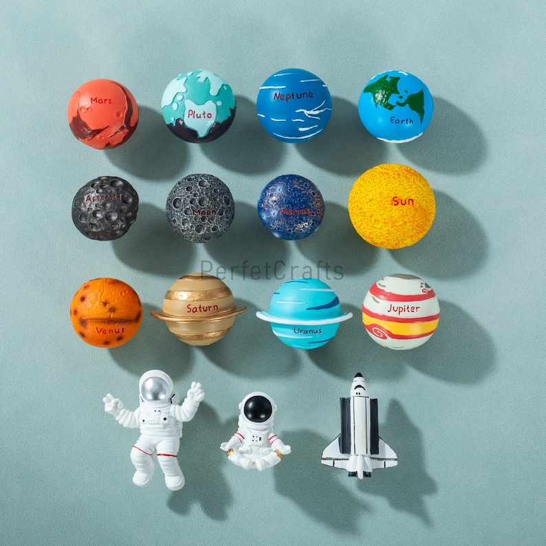 May include: A collection of colorful planet and space-themed toys. The planets include Mars, Pluto, Neptune, Earth, Venus, Saturn, Uranus, and Jupiter. Also included are two astronaut figures and a space shuttle.