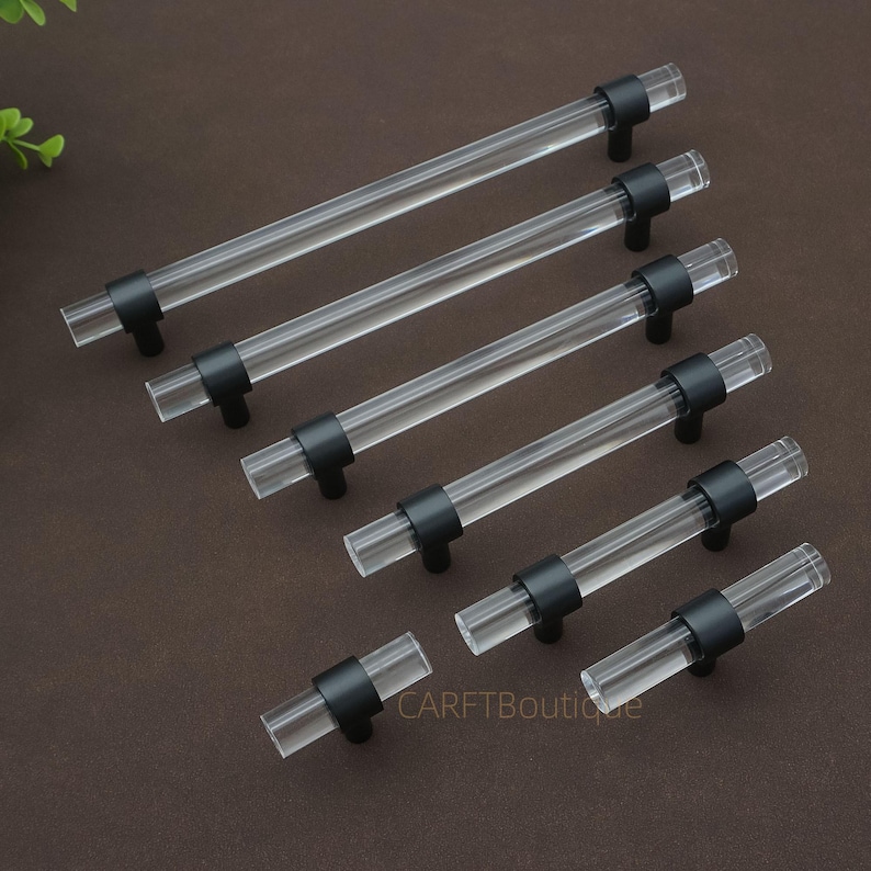 May include: A set of three ceramic mugs with a speckled, matte finish in cream, light grey, and dark grey. Each mug has a simple, modern design and a rounded handle. The mugs are stacked on top of each other.